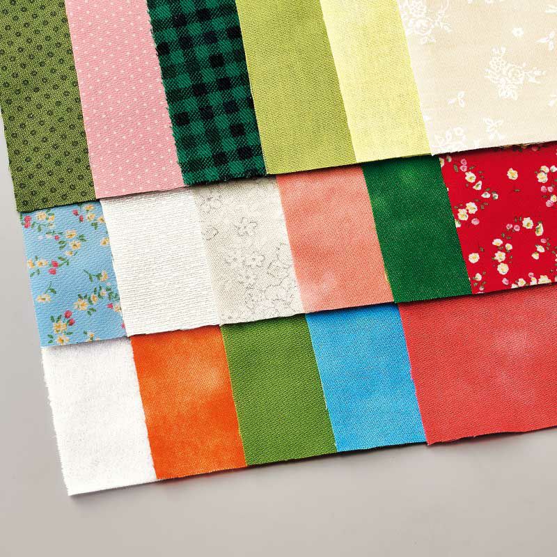 ぼかしや可愛い花柄のコットン布をメインに17枚の布を使って作ります